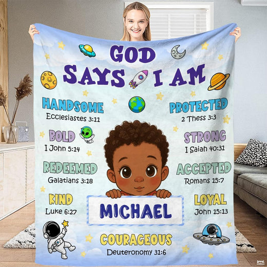 God says I am little astronaut boy scripture throw blanket held open by woman