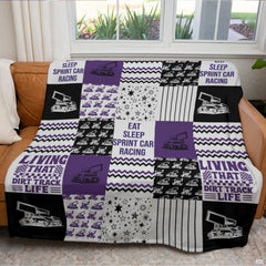 Checkered thematic accent flags and speedway artwork on a violet collage bedding set.
