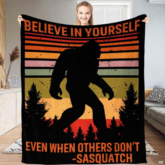 Bigfoot silhouette walking through pine trees on a retro sunset bedding set.