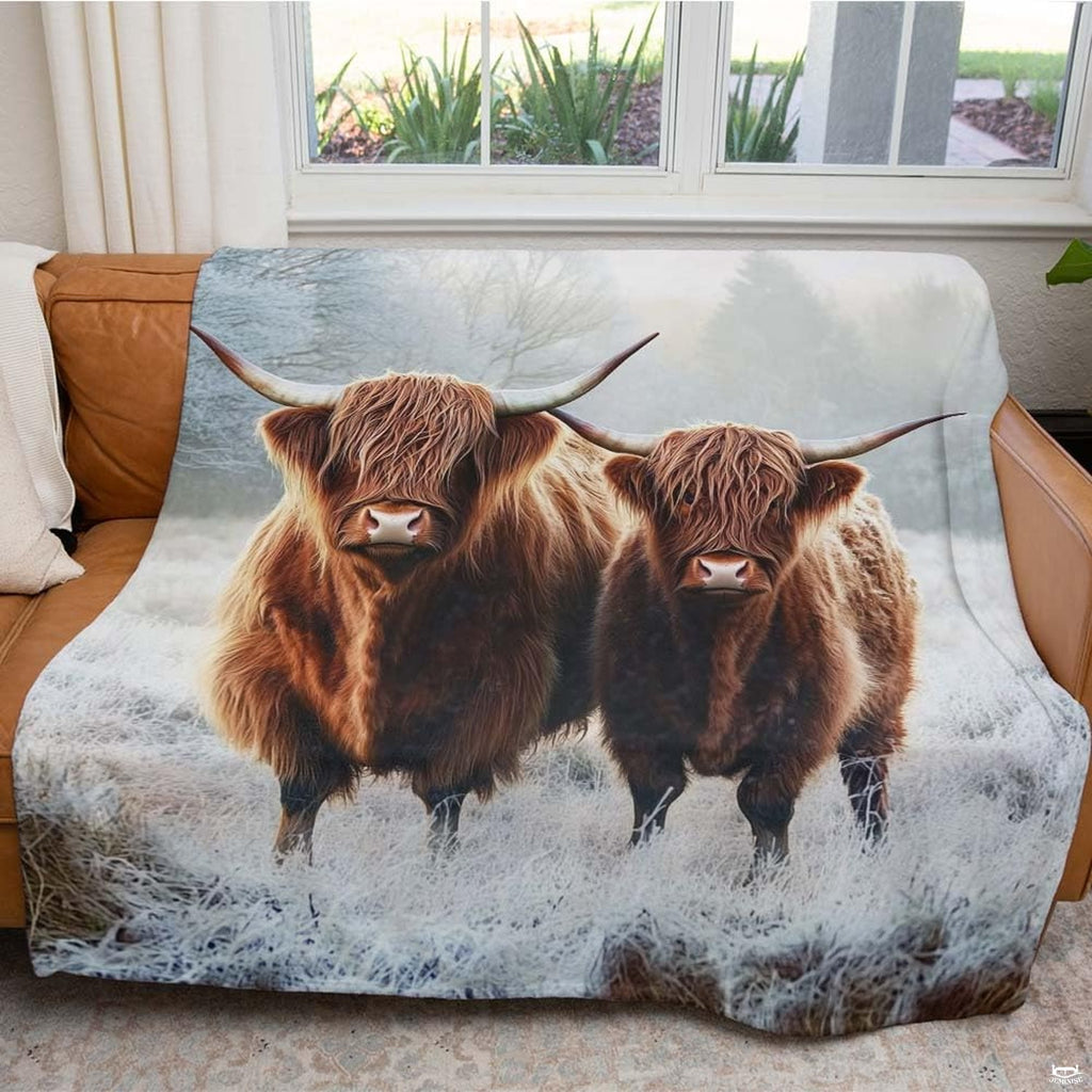 Wildlife illustrated scottish highland cow bedding styled in a rustic modern bedroom.