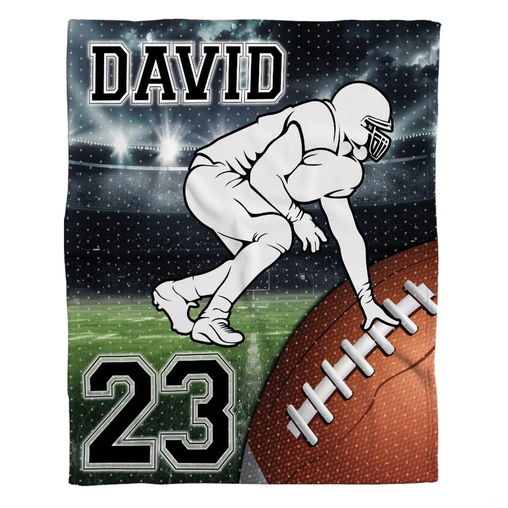 Woman holding open football lineman throw blanket showing nighttime stadium and varsity lettering