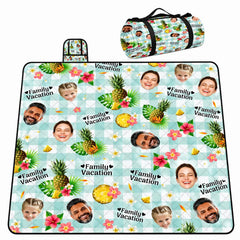 Tropical pattern of pineapples, pink hibiscus, and palm leaves on mint gingham, view 1.