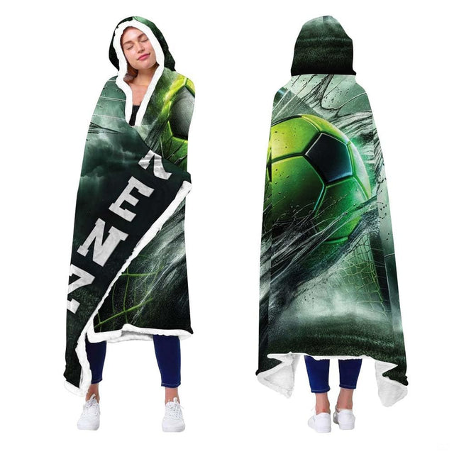 Person showcasing neon green soccer sports blanket with stretched net impact and stadium smoke