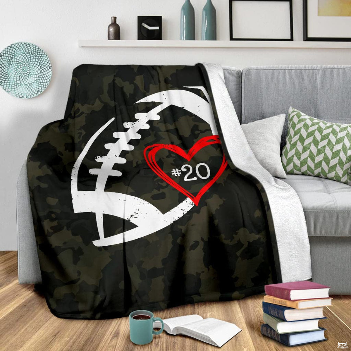 Camo athletic football blanket displayed on living room armchair