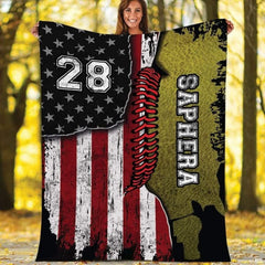 Patriotic split stars and stripes flag paired with textured softball graphic artwork on modern bedding display.
