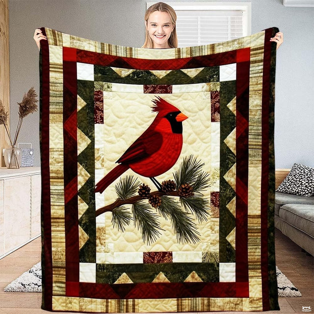 Rustic red bird bedding featuring a vibrant cardinal on pine branches framed by green and cream patchwork borders.