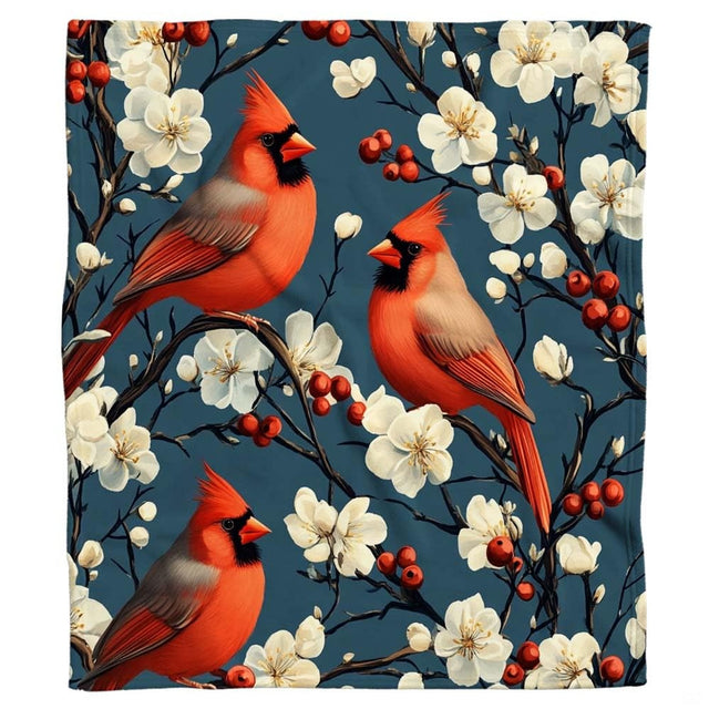 Flat display of red cardinals and white blossoms botanical blanket.