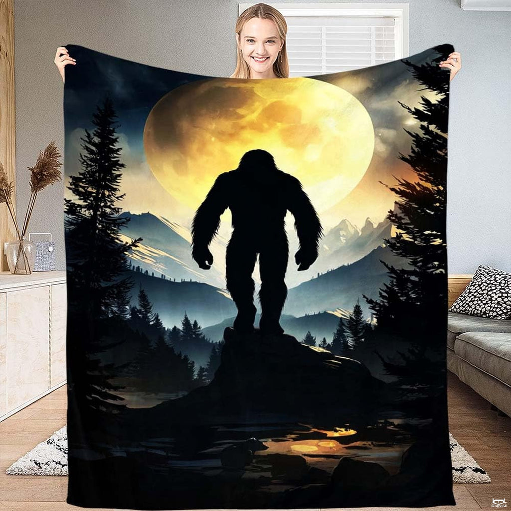 Bigfoot golden full moon blanket featuring Sasquatch silhouette on mountain ridge.