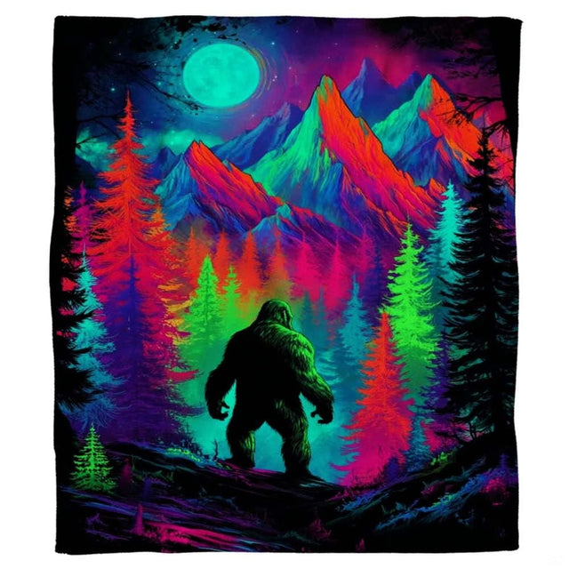 Psychedelic neon Bigfoot Sasquatch standing among glowing mountains and pines, view 2.