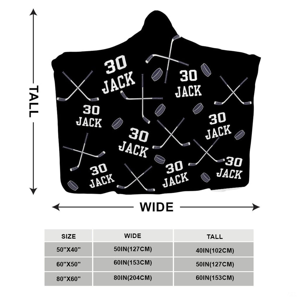 Navy blue sports bedding layout displaying flying pucks and crossed sticks motif.