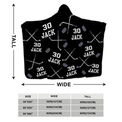 Navy blue sports bedding layout displaying flying pucks and crossed sticks motif.
