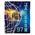 Flaming hockey puck blanket showing puck trailing fiery flames hitting the white net mesh.