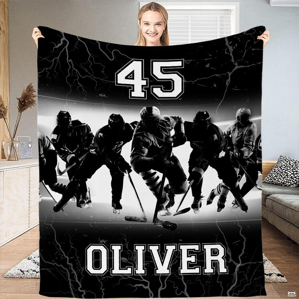 Full flat view of ice hockey team throw blanket showing monochrome players and varsity text.