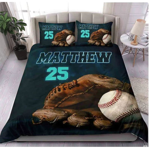 Spruce teal and navy baseball athletic sports bedding set displayed on a bed in a modern room