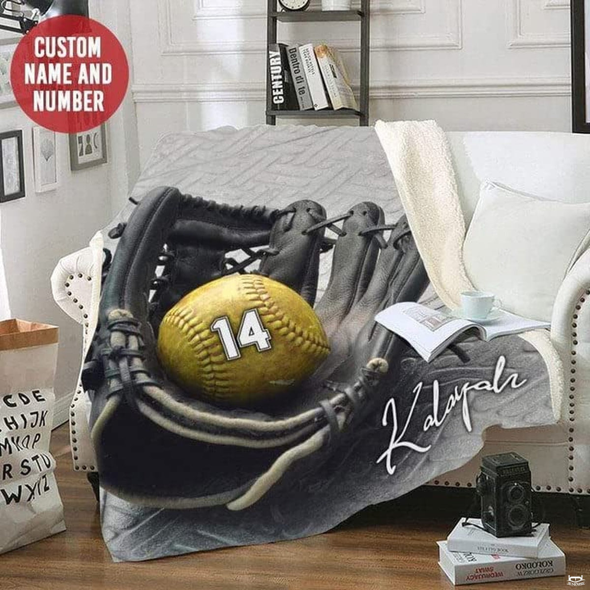 Black softball mitt print draped across a white armchair in a quiet reading room corner.