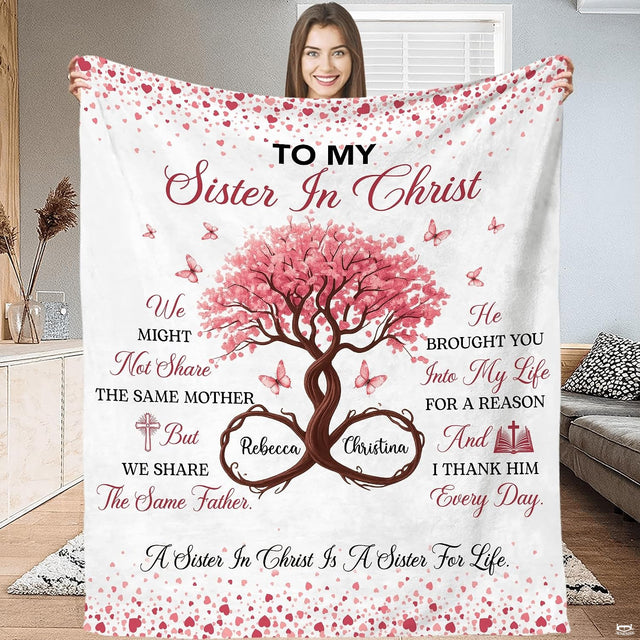 Cherry blossom throw artwork displaying blooming pink floral branches and delicate butterflies on white.