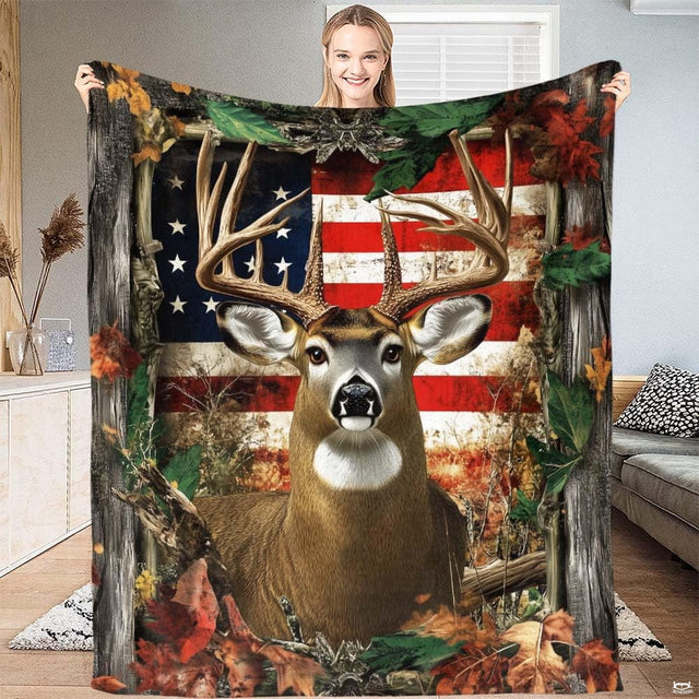 Close up view of whitetail buck artwork with large antlers and distressed stars and stripes on bedding.
