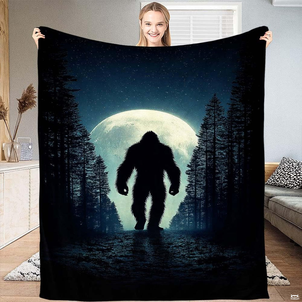 Bigfoot giant full moon forest blanket featuring Sasquatch silhouette walking under lunar light.
