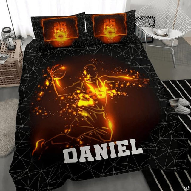 Close-up perspective of sports bedding detailing radiant orange embers, player silhouette, and geometric lines