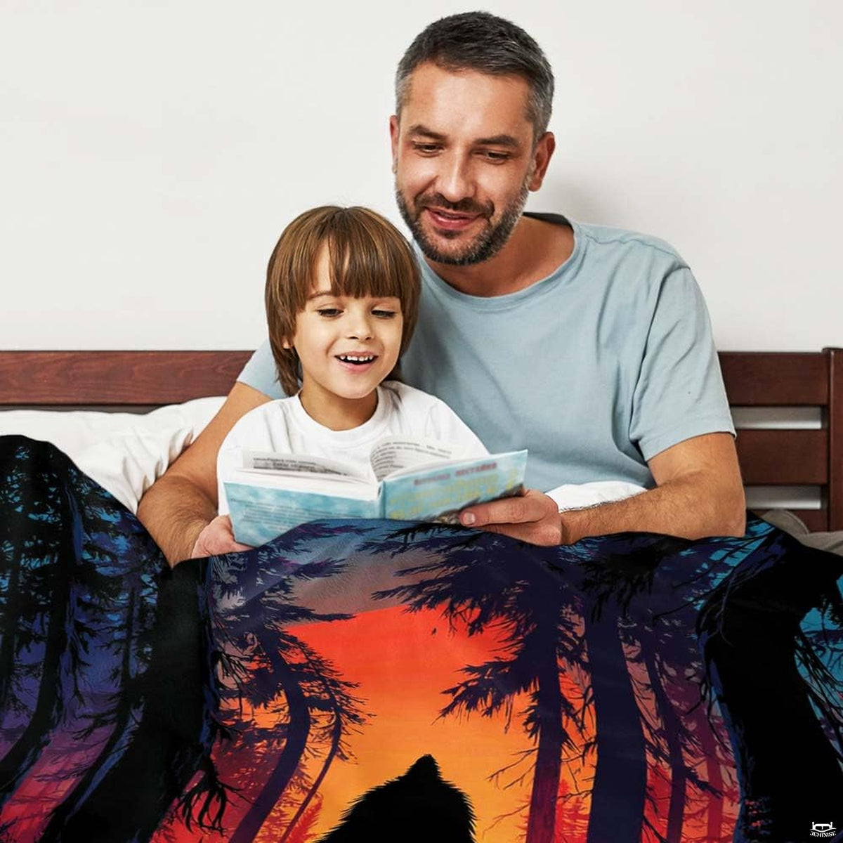 Sunset Bigfoot throw blanket view 3 highlighting fiery amber sunset and pine timber silhouettes