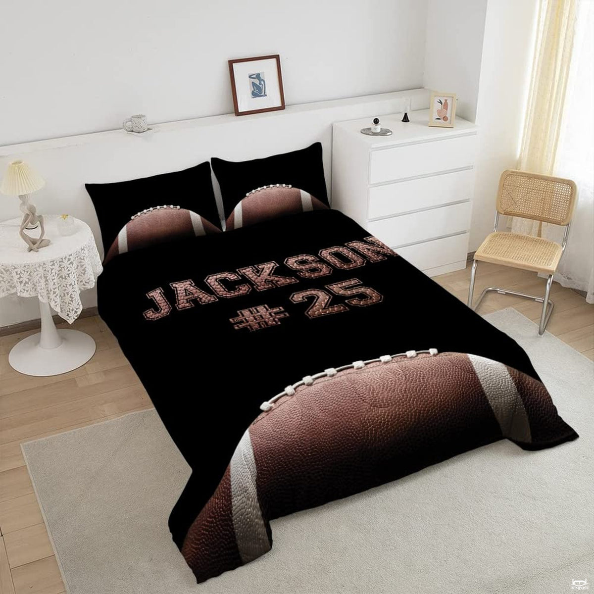 Close-up perspective of football bedding showing detailed pebble grain textures on lettering and ball arc