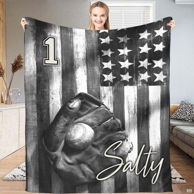 Monochrome baseball glove over painted flag stripes on a distressed bed set display.