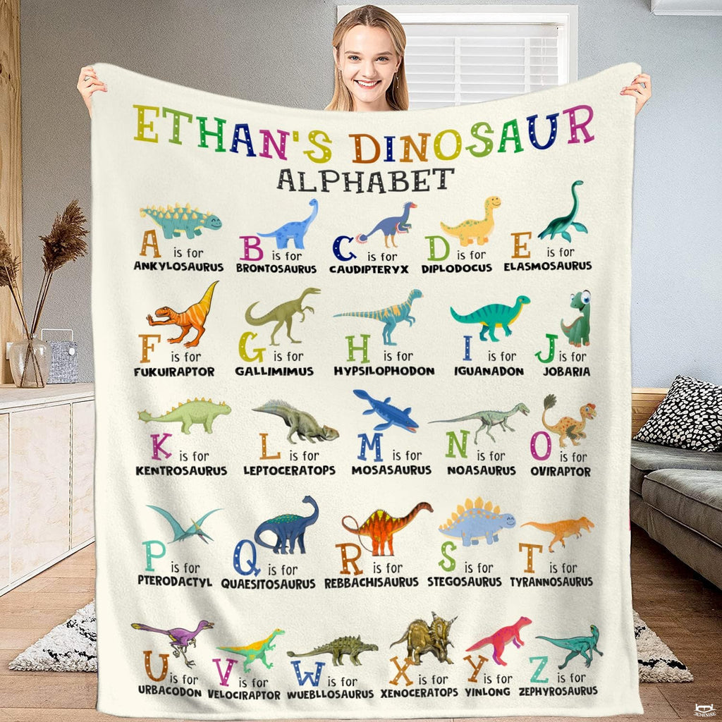 Illustrated thematic accent thematic accent ABC bedding set showcasing colorful prehistoric creatures on a thematic...