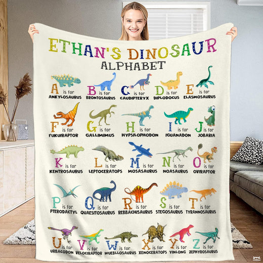Illustrated thematic accent thematic accent ABC bedding set showcasing colorful prehistoric creatures on a thematic...