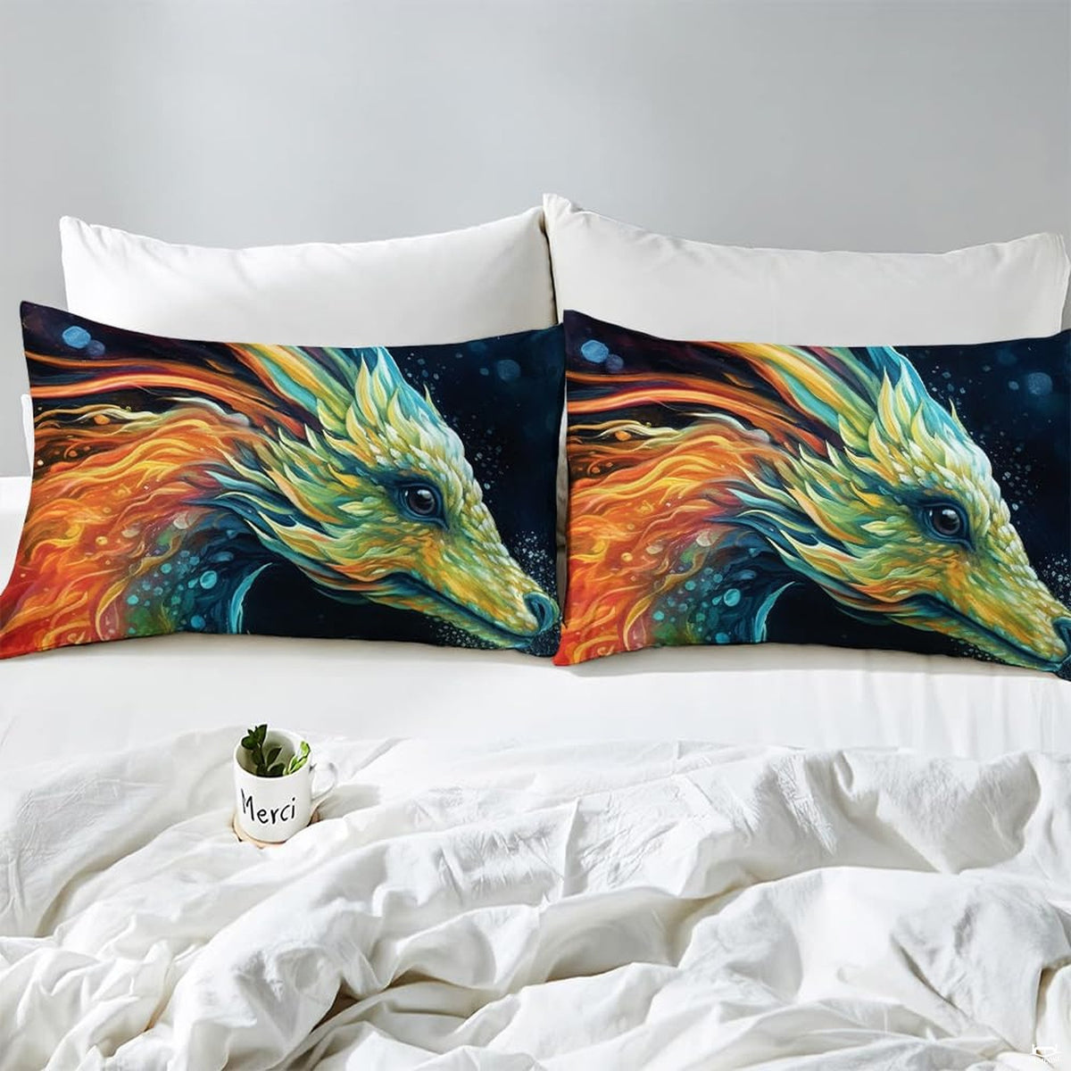 Close-up detail of dragon fantasy bedding highlighting vibrant turquoise wings and deep cosmic navy contrasts.