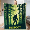 Sasquatch forest silhouette throw blanket showing legendary cryptid walking through sunlit evergreen pines