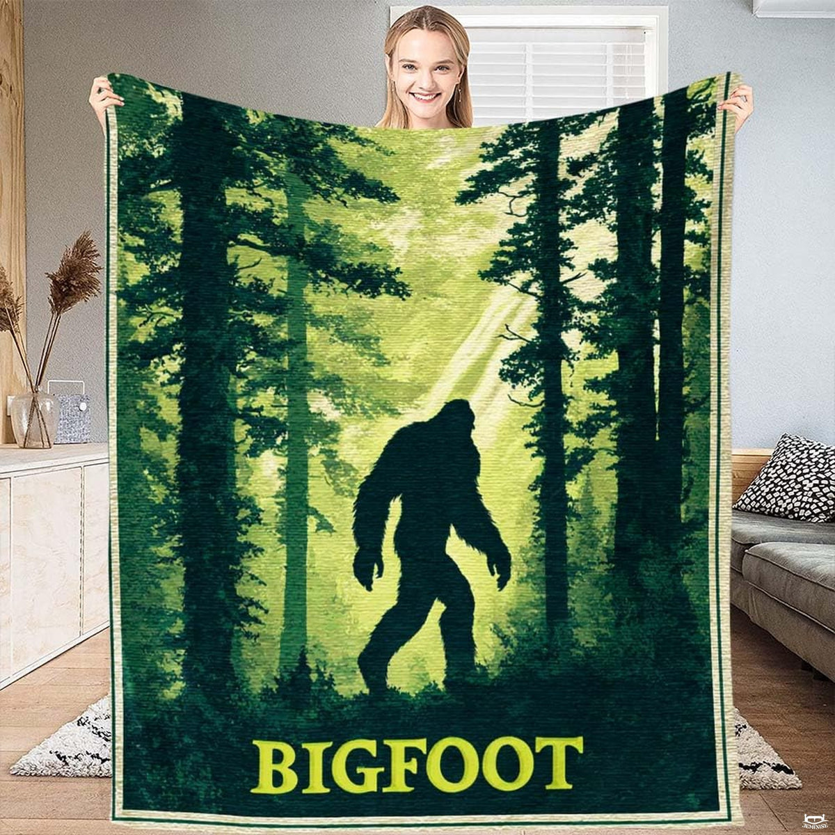Sasquatch forest silhouette throw blanket showing legendary cryptid walking through sunlit evergreen pines