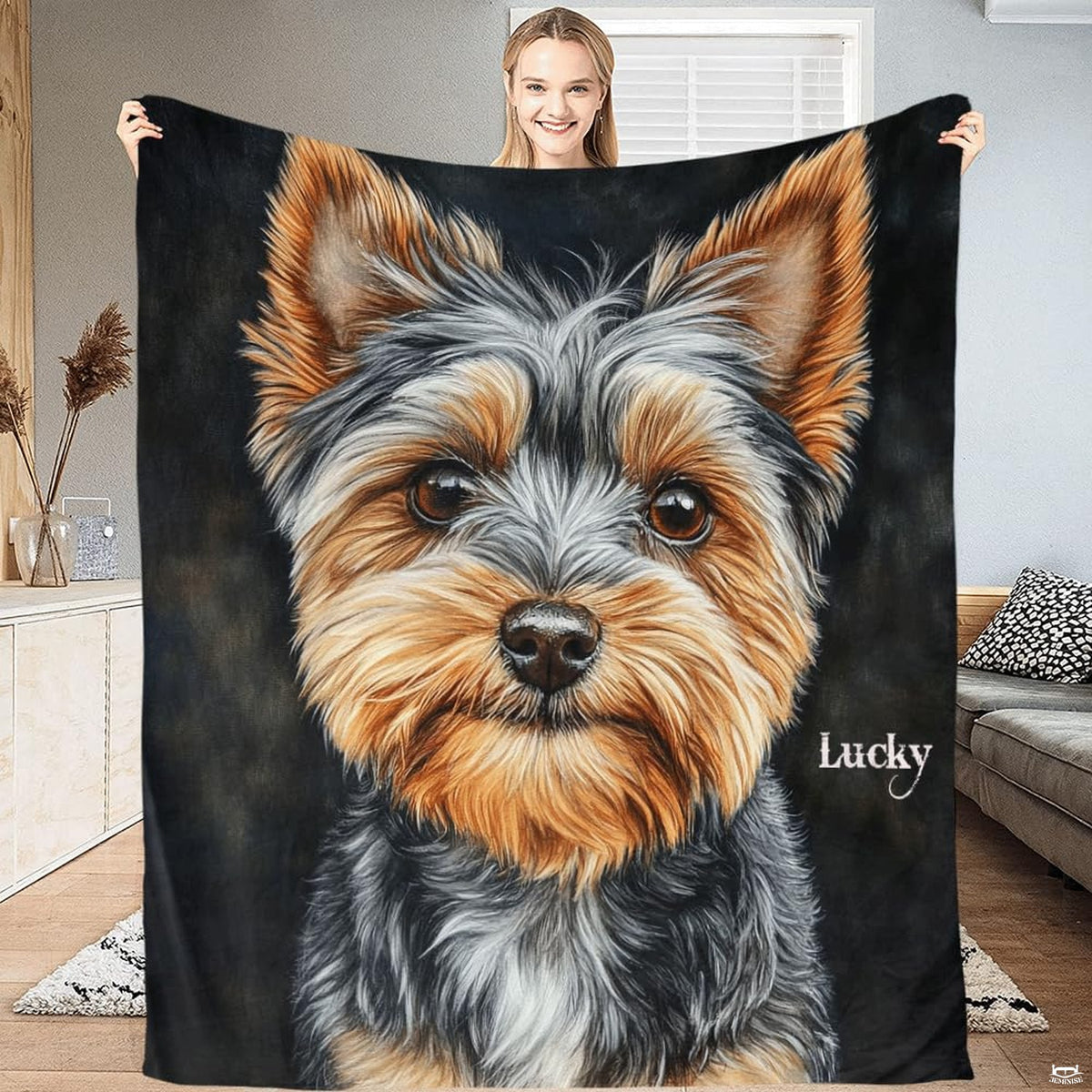 Living room sofa display showing the Yorkshire Terrier dog throw blanket draped over furniture.