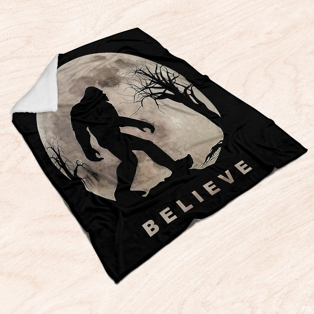 Sasquatch silhouette against thematic accent moon and bare trees styled in rustic folklore bedroom decor