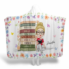 Charm bedding set showing reading girl with butterflies and pastel wildflowers.