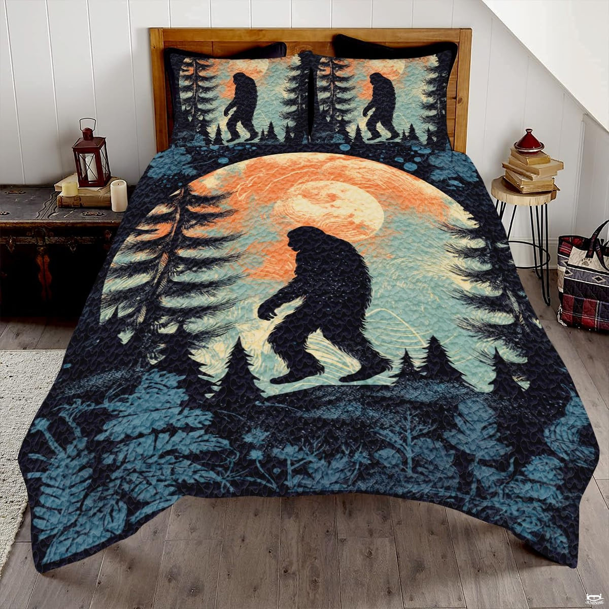 Sunset forest Bigfoot Sasquatch woodland bedding set displayed on a bed in a rustic mountain lodge