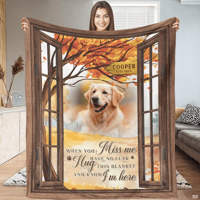 Front view of autumn window dog memorial throw blanket held upright showcasing rustic window artwork.