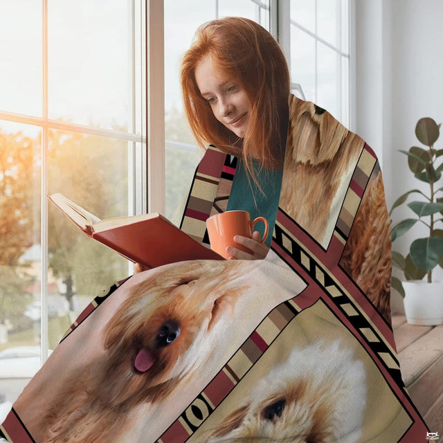 Close view of painted golden doodle portraits and tribal border on blanket