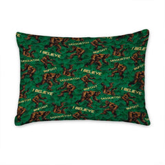 Matching pillow shams displaying an all-over forest creature pattern on an emerald bedding set