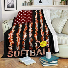 Fiery flag sports graphic with crossed bats draped over living room armchair with open novels.