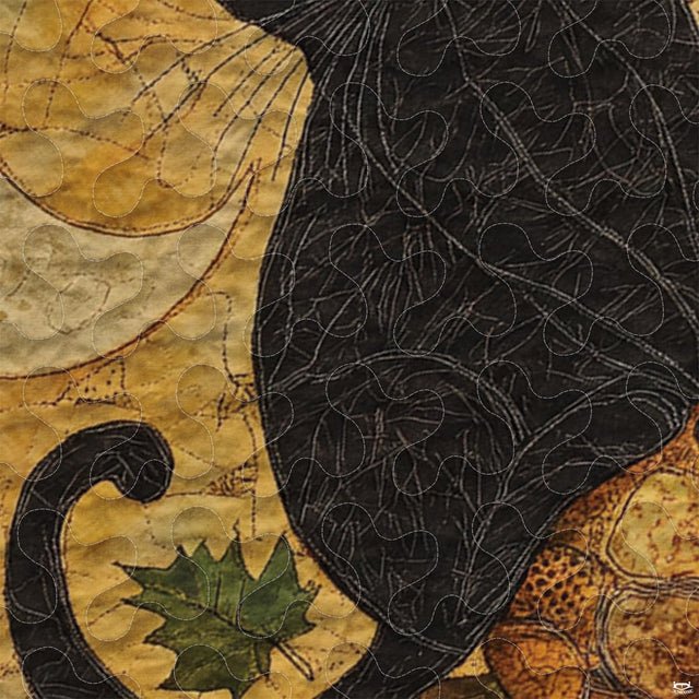 Overhead view of moonlit black cat bedding surrounded by thematic accent russet and gold patchwork decorative borders.