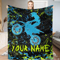 Airborne motocross dirt bike rider silhouette with neon splatters and tire tracks, view 1.