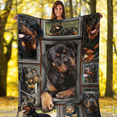 Outdoor view of a model holding up the full Rottweiler gallery throw blanket.