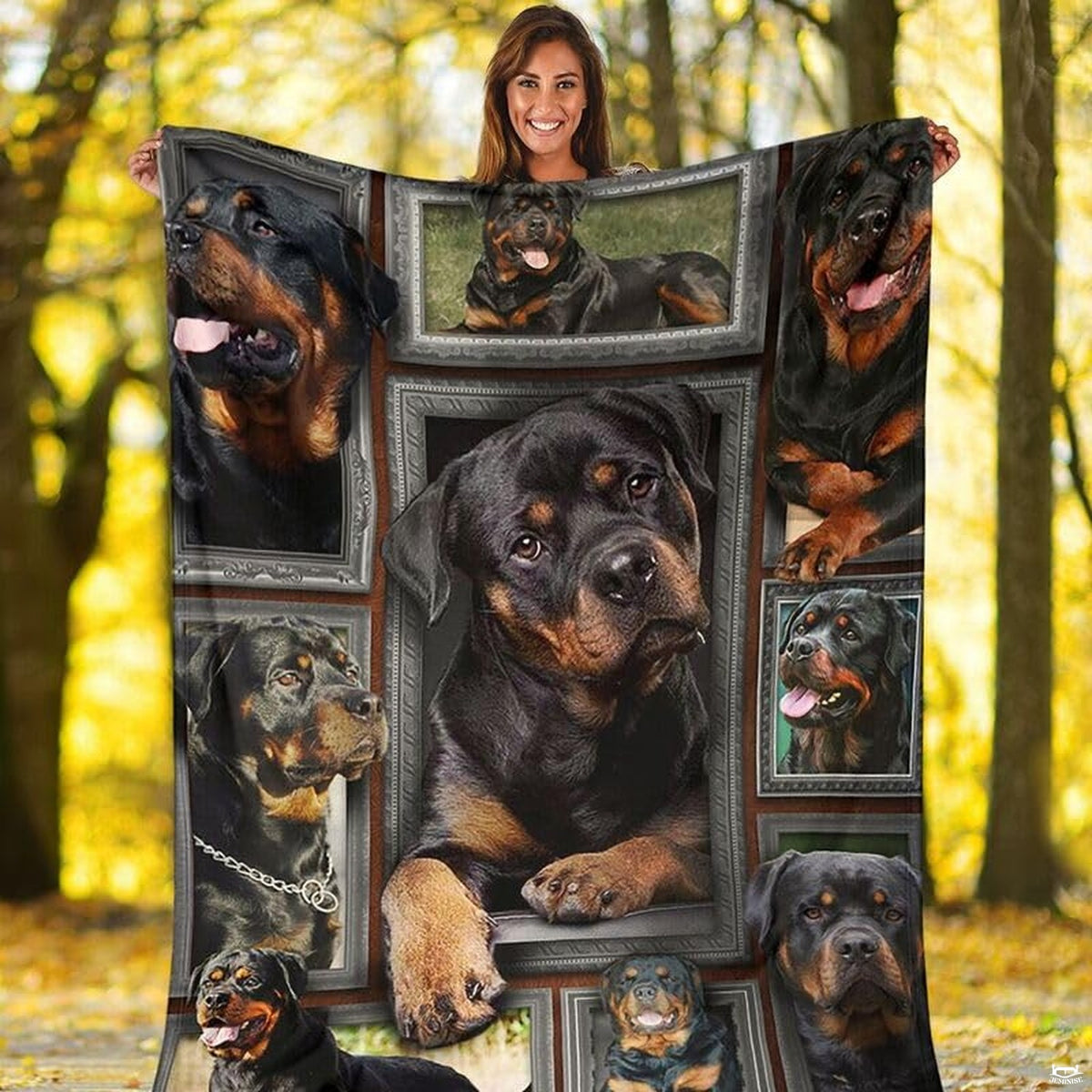 Outdoor view of a model holding up the full Rottweiler gallery throw blanket.