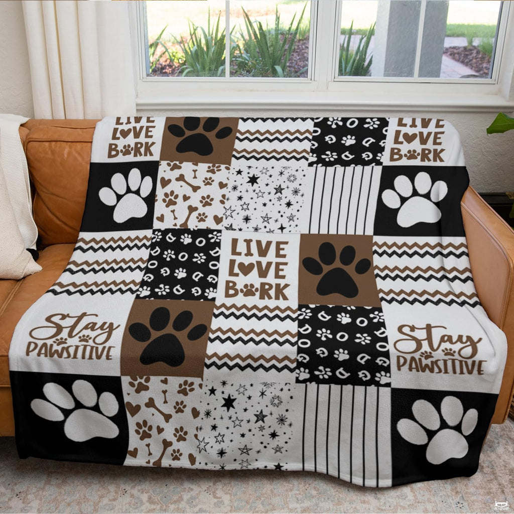 Chocolate brown dog paw throw blanket view 3 highlighting patchwork pattern squares, bones, and stripes