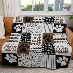 Chocolate brown dog paw throw blanket view 3 highlighting patchwork pattern squares, bones, and stripes