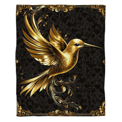 Close-up of radiant gilded hummingbird feathers and ornate rococo flourishes.
