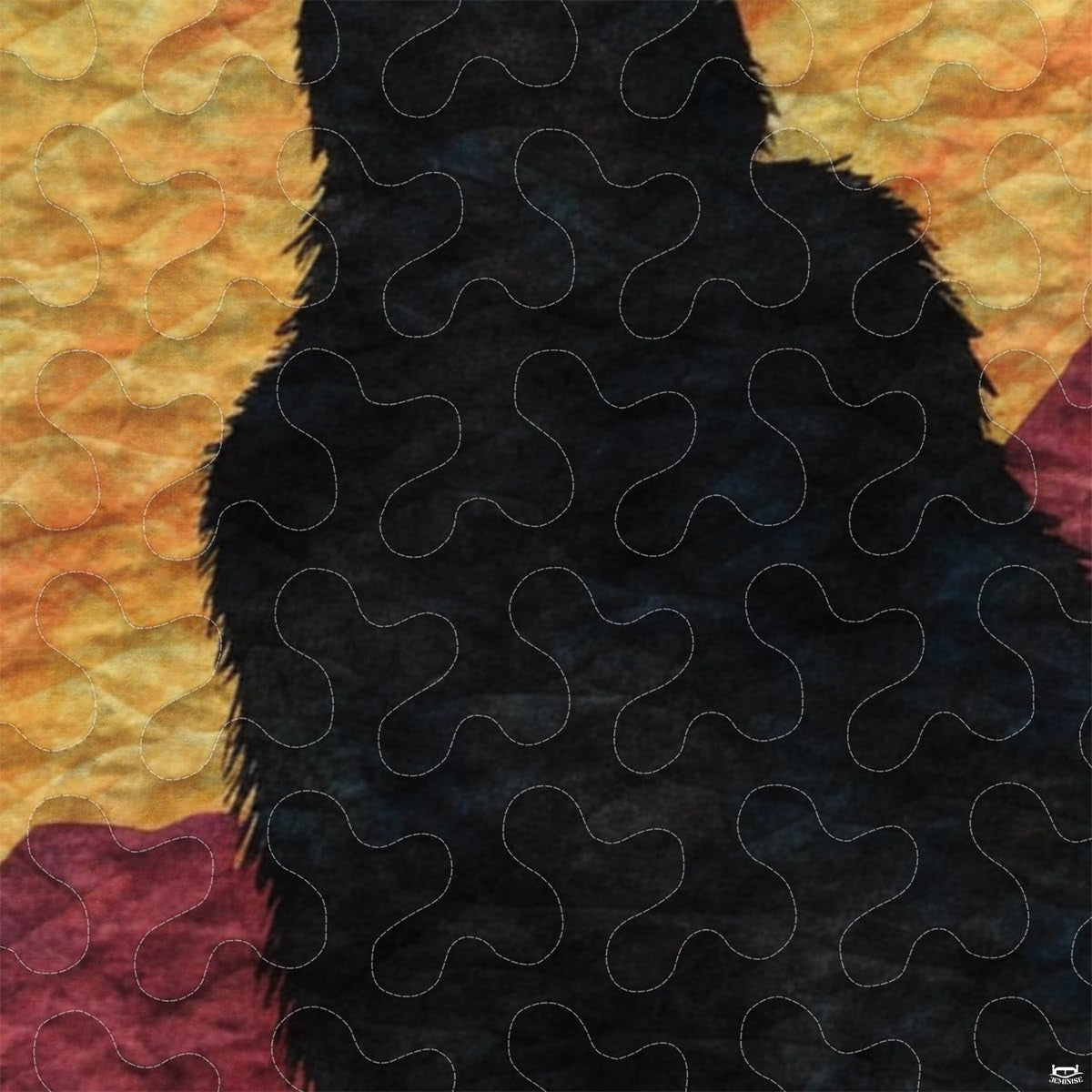 Close-up view of Bigfoot bedding showcasing scarlet sunset stripes, evergreen pines, and Sasquatch silhouette