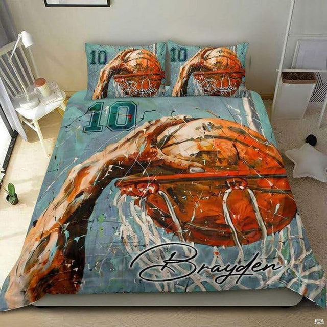 Dynamic basketball slam dunk bedding visual showcasing fiery orange watercolor and mint splashes.