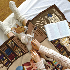 Bedroom interior showcasing the letter A bookshelf throw blanket displayed over an accent lounge armchair.