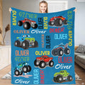 Monster trucks blue cartoon throw blanket displaying shark trucks and giant off-road tires on blue
